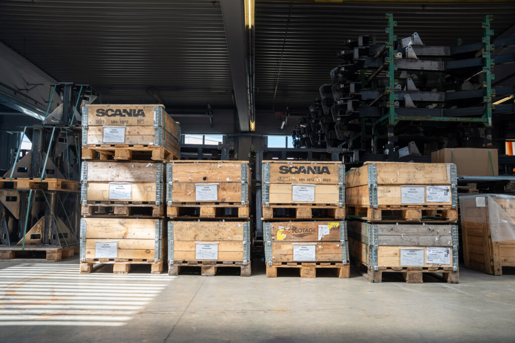 Stacked pallets and transport crates in the warehouse