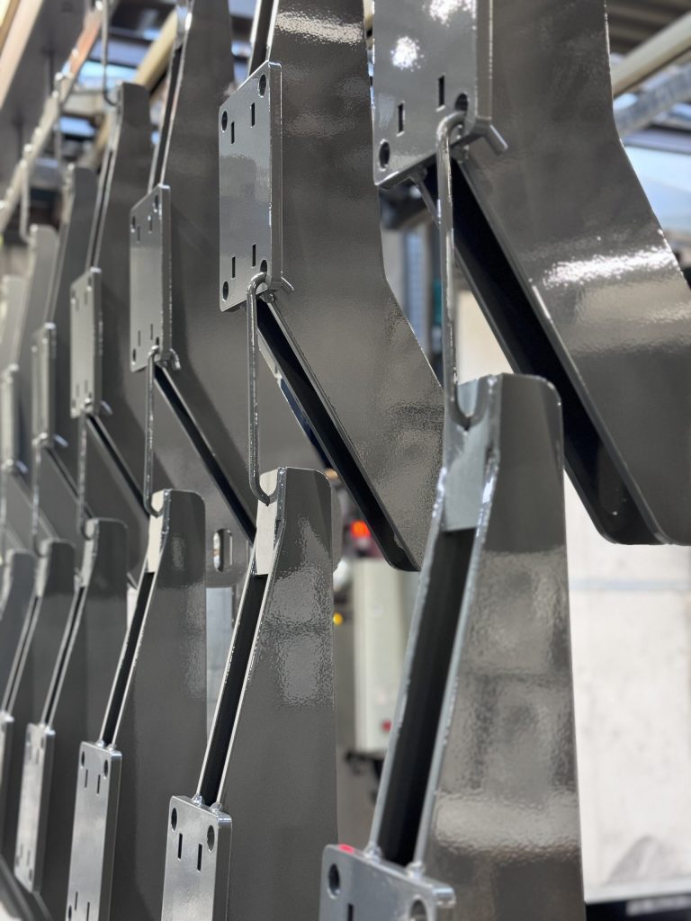 Black coated brackets on the coating line