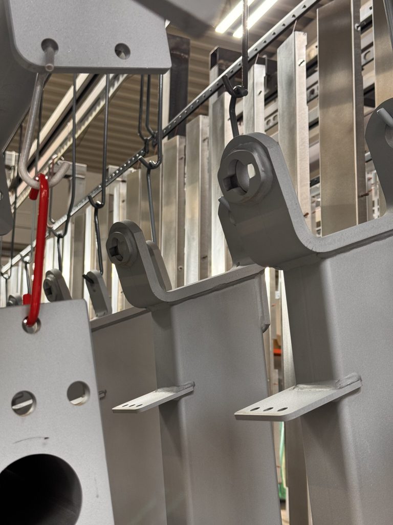 Coated machine frame