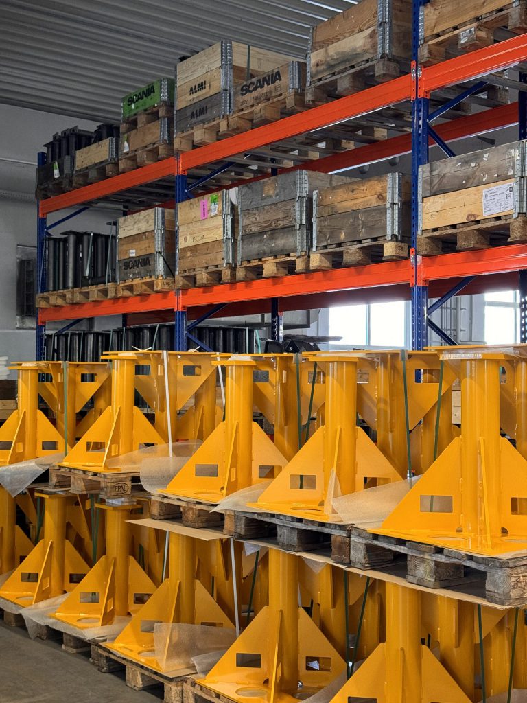 Yellow coated steel beams in the storage rack